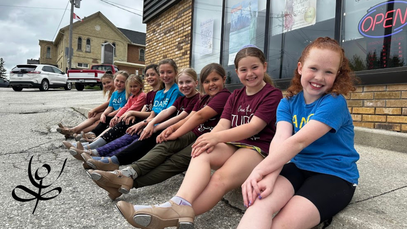 smiling dancers out front of KMSD Hanover
